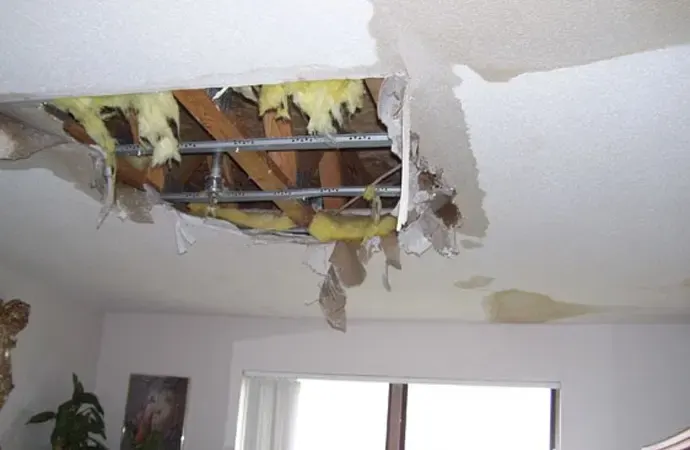 Water-damaged ceiling under a leaking roof after a Louisiana storm